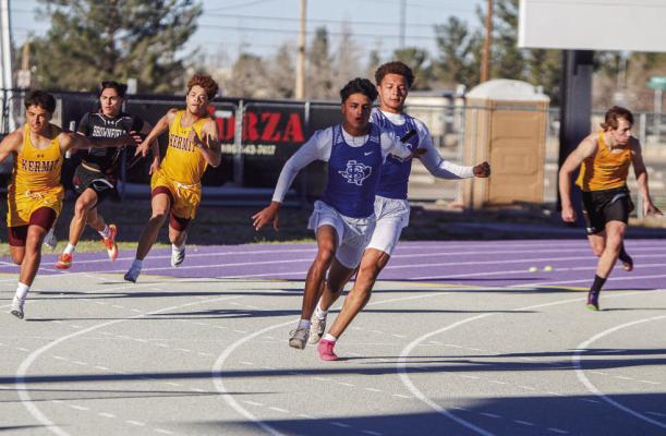Fort Stockton senior Isaiah Garcia, middle back, hands off the baton in the 400 relay to cousin Marco Garcia for the final leg of the race during the West of the Pecos Relays on March 3. The relay squad, which also features Eduardo Hernandez and Aryan Hernandez, has taken two firsts and a second this season. Photo by Nathan Heuer