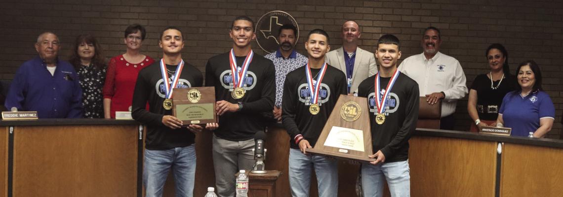 The state champion 1600-meter relay team of Aryan Hernandez, Marco Garcia, Jesus Hernandez, and Zane Hodges is shown with coaches and the Fort Stockton Independent School District Board of Trustees, Monday night. The board honored the state champions and recognized Hodges as May Student of the Month. Photo by Shawn Yorks