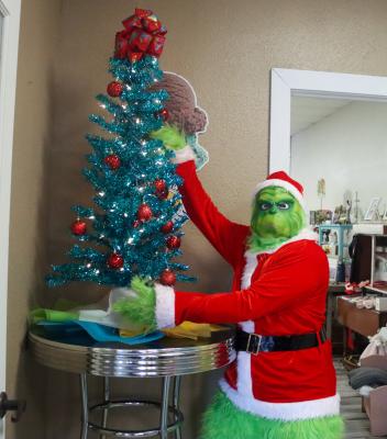 The Grinch greeted visitors to the Mesquite Tree Gift Shop’s open house on Saturday. The Grinch will be back in Fort Stockton Friday at Annie Christmas Welcome at the Annie Riggs Museum from 5:30-- 8:30 p.m. Photo by Shawn Yorks