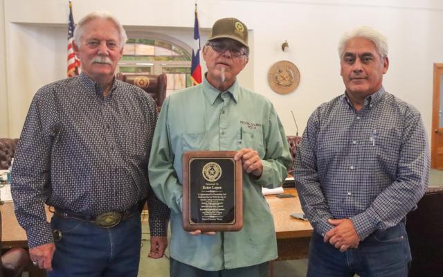 Ector Lopez was honored for his service to Pecos County at the Dec. 27 commissioner’s court meeting. Lopez started out in building and ground maintenance at the courthouse in 1986, moving on to Assistant Building Supervisor at the courthouse, Road and Bridge Skilled Worker for Precinct 4, Road and Bridge Equipment Operator for Precinct 4 and has been the Precinct 4 Road and Bridge Supervisor since 2007. From left are County Judge Joe Schuster, Lopez and outgoing Precinct 4 Commissioner Santiago Cantu. Photo