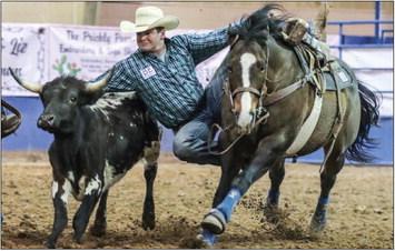 Logan Wiseman of Paola, Kansas, competes in Steer Wrestling, Friday night. Wiseman was third overall in the event last weekend. Photo by Shawn Yorks