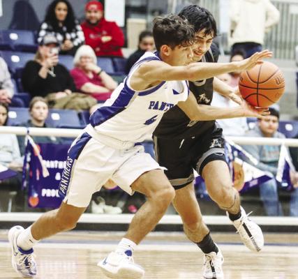 Diego Ronquillo fights off an Andrews player last week. Ronquillo scored 21points against Andrews and 18 in a loss to Greenwood. File photo by Shawn Yorks