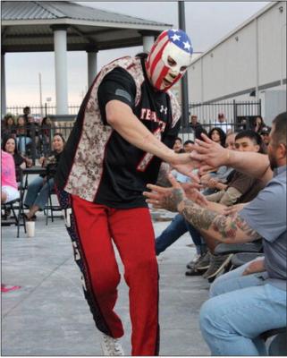 Famous Lunchador excites the crowd before this past weekend wrestling match. Photo by Tristian Barragan