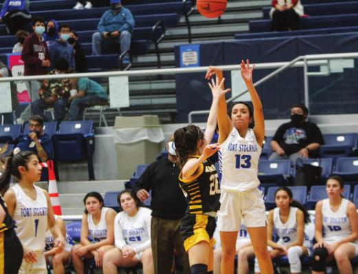 Fort Stockton junior Alyana Dominguez (13) takes a jump shot over Seminole’s Londyn Shain during the second half of Tuesday’s game at the Special Events Center. Photo by Nathan Heuer