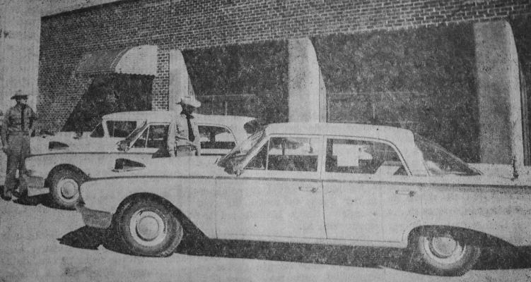 January 1960… Police Chief G.W. McDonald (left) and patrolman Otha Peeples inspect the latest additions to Fort Stockton city rolling stock. At center and right are two new patrol cars received last week. Ordered some months ago, arrival was delayed by the steel strike. At far left is a 1957 patrol car, still in use after 94,000 miles.