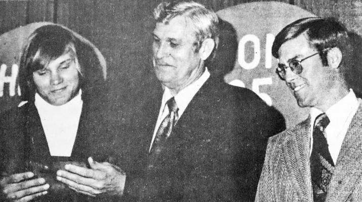 January 1975 … OUTSTANDING PLAYER HONORED – Bill Mehan expresses pleasure at being chosen as the outstanding Panther player of the year at the annual Booster Club Football Banquet Monday night. Mehan, who was a senior tailback-linebacker of the team, was presented the award by Booster Club President Dave Martin (center). Looking on is Panther Head Coach Bill Pearce.