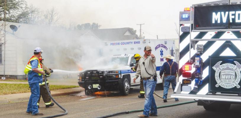 The Monahan’s Volunteer Fire Department works to put out the fire started on the front passenger side of a Pecos County EMS ambulance on March 22 in Monahans. Photo courtesy of The Monahans News
