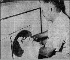 October 1959: BIG HELP – Gym custodian Felix Gonzales prepares to deposit part of the almost-daily Panther football wash in a dryer added to athletic department equipment this year as a gift from Powell Butane Inc. It helps keep the Panthers in clean gear.