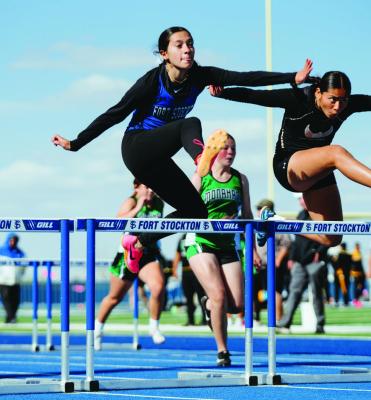 JV athlete Addison Castro clears a hurdle during the girl’s 300M race. Castro did well in the 100M and 300M hurdles as well as the triple jump. Photo by Aaron Owens