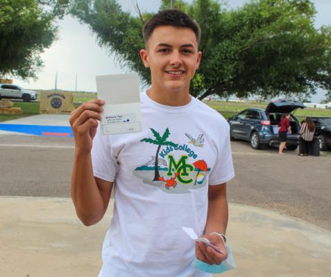 LEFT: Estevan Hernandez won one of the door prizes at the Midland College/WRTTC New Student Orientation. His prize was a gift card to the Mesquite Tree Gifts, Ice Cream & Coffee Shop. Also providing a gift card for the event was Glitzy Trendz. Photos by Nathan Heuer