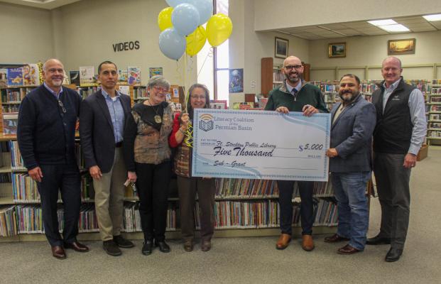 Pictured from left to right is executive director Mark Palmer, BOD member Sal Salazar, BOD member Alice Duerksen, library director Elva Valadez, executive director John Trischitti, BOD member Adrian Carrasco. Photo by Nathan Heuer