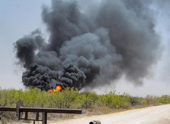 Smoke pour off a fire at 2:23 p.m. on April 20 at a tank battery complex site located eight miles east of Fort Stockton. 
