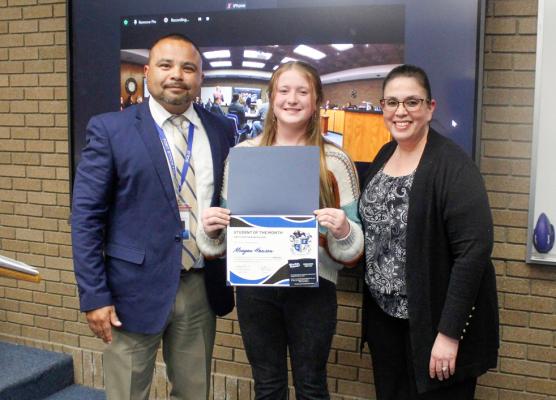 Meagan Hanson was honored as the Middle School Student of the Month for March on March 27 at the district’s board meeting. Presenting Hanson the award was middle school principal Sammy Soliz, left, and associate principal Sabrina Cordova.
