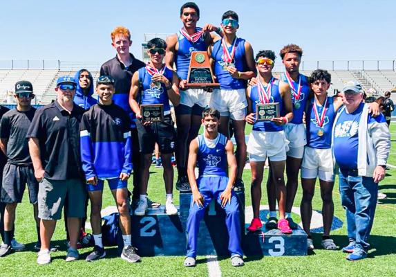 The Panther track team celebrates their 4A District 3 title atop the podium at Greenwood High School on April 15. Courtesy Photo