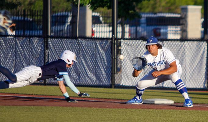 Xzavier Dominguez, right, nearly makes a tag out on a pickoff throw from Fort Stockton Pitcher Gerry Diaz during the Panthers home game on April 18 against Greenwood. Photo by Nathan Heuer