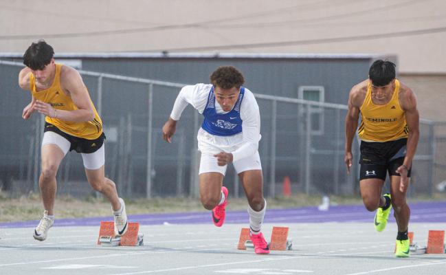 Fort Stockton senior Isaiah Garcia, middle, explodes out of the blocks during the 100-meter dash at the West of Pecos Relays on March 3. Photo by Nathan Heuer