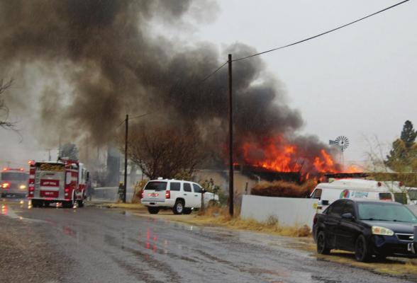 The Fort Stockton Fire Department works to put out a fire of a combined trailer at 227 Bishop St. in Fort Stockton around 2:30 p.m. on Wednesday Dec. 30. (Photo by Nathan Heuer)