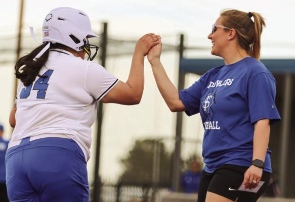 Fort Stockton Prowlers head coach Darrian Roberson congratulates Adree Bueno on a home run against Lake View. Bueno hit a home run Friday at Greenwood in Fort Stockton’s 5-4 loss. Photo by Shawn Yorks