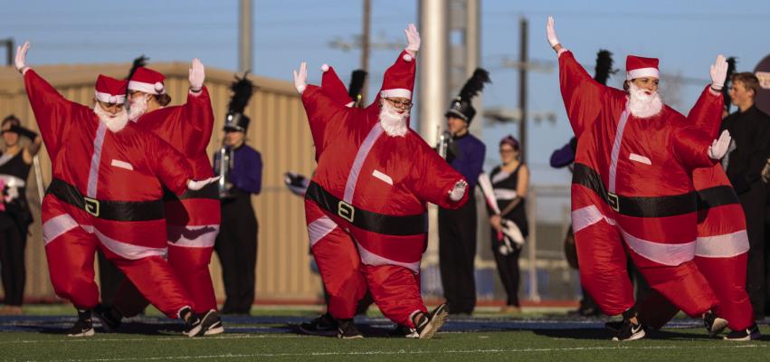 The Wylie Belles Dance team dressed as Santa for their halftime performance Saturday in Fort Stockton. 
