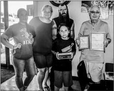 Dwayne Bonham, right of the Fort Stockton Amateur Radio Club recognized Thomas Kincaid, 10, of Fort Stockton for earning his Amateur Radio License, Saturday at Pepito’s. Kincaid was presented with his license and a FT-4X Dual Band Radio Transceiver. Pioneer Photo