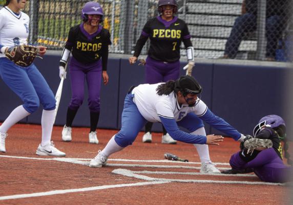 Fort Stockton pitcher Aryanna Gonzalez, middle, attempts to tag out Pecos’ Yulissa Hernandez during Friday’s game on the Prowlers home field. Hernandez was caught in a pickle during the sequence and was called safe at home plate in the second inning.