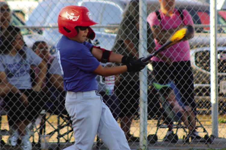 Little Leage hitter Zayden Calderon gives it his all at a recent game.