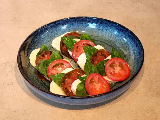 Caprese salad with heirloom and Roma tomatoes. Photo by Kara Gerbert