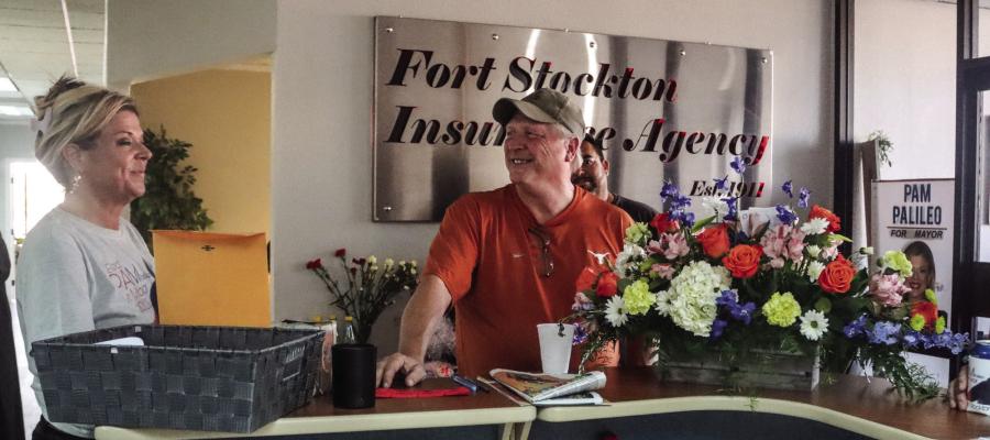 Pam Pallileo, left, speaks to a visitor at Fort Stockton Insurance Agency’s 112th Anniversary celebration, Friday. Pallileo has operated the agency for six years. Photo by Shawn Yorks