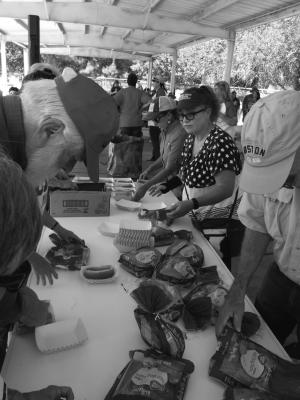 Fort Stockton Rotary Club members Terry Wigham, Wayne Dyess, Daila McAnaly and Betsy Briscoe assemble hot dogs for the contestants at the 4th of July Hot Dog Eating Contest in Rooney Park. Photo Courtesy of the Fort Stockton Rotary Club