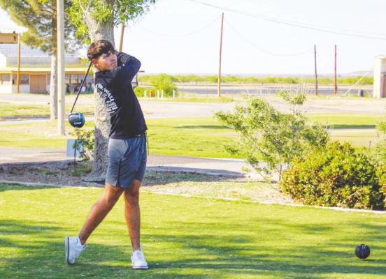 Fort Stockton’s Alex Williams views his tee shot after getting a few practice swings in at the Desert Pines Golf Course in Fort Stockton on May 4. Photo by Nathan Heuer