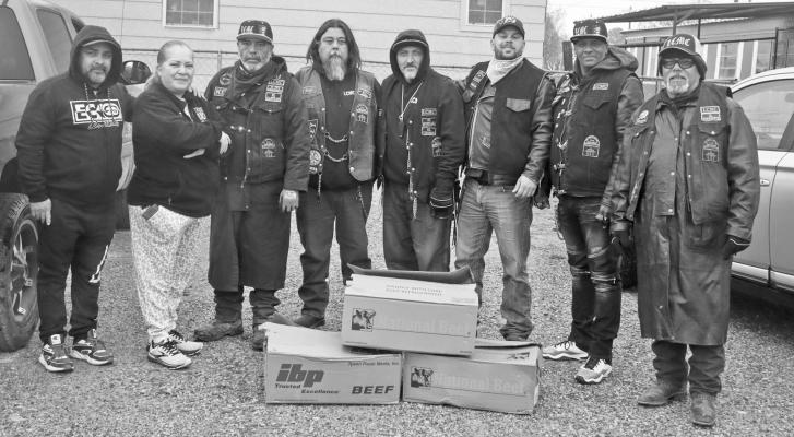 The Los Canales Motorcycle Club of Fort Stockton and McCamey gave two Thanksgiving meals to families in in need in Fort Stockton. Club members were Jeff Mulholland Sr., David Broussard Sr., George Fabela, Frank Muniz, Angel Corrales and Joe Pedersen. The club has been giving Thanksgiving meals for several years and also hands out Christmas gifts to children in need every year. Photo by Shawn Yorks