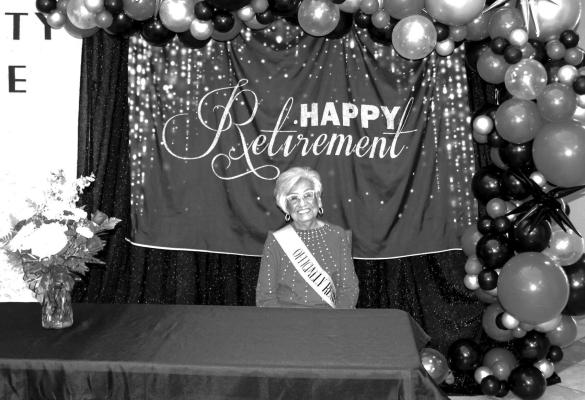 Santa Acosta looks happy at her retirement ceremony, having served 27 years with the Pecos County Tax Office. Photo by Kerry Waldrip