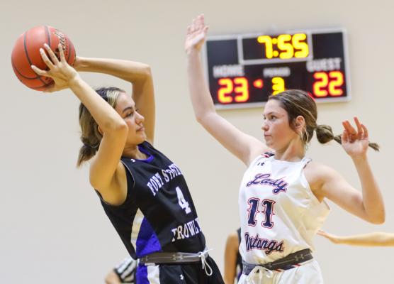 Fort Stockton's Ivanna Ortiz looks to pass as Midland Christian's Annie Munoz defends, Dec. 30, 2022, in Monahans. Photo by Shawn Yorks