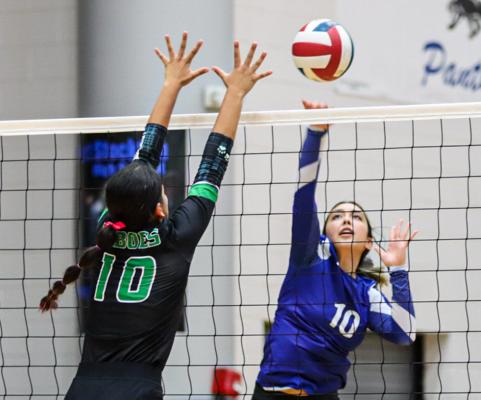 Fort Stockton senior Angelina Aguirre (10) hits the ball over the net as Monahans senior Natalie Hernandez (10 defends, Saturday. Photo by Shawn Yorks