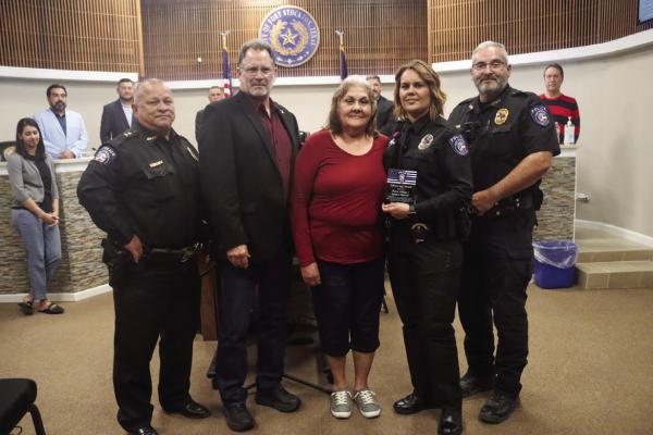 Fort Stockton Police Department Patrol Officer 1, Jessica Sherill, was joined by her mother, Mayor Chris Alexander, Police Chief Robert Lujan, Sergeant Enrique Irigoyen Jr. and the rest of the city council and staff during the Dec. 12 city council meeting. Sherill was recognized for her life-saving efforts during a call for service on Nov. 14. Photo by Shawn Yorks