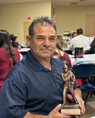 Ronnie Chavez with his 30-year firefighter award. Courtesy photo