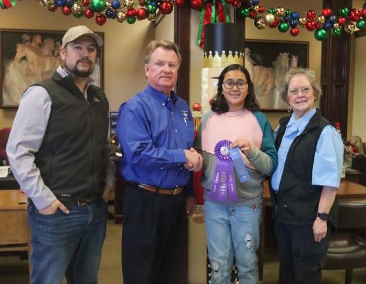 Youth Winners in the Pecan Food Show were Grand Champion (Pies) Mabis Mandujano with her Mini Caramel Pecan Pie, and Reserve Grand Champion (Candy) Mikki Mandujano with her Butter Pecan Fudge. From left are Payton Kiefer, Pecos County State Bank President George Hansard, Youth Grand Champion Mabis Mandujano and Extension Agent Karan Heffelfinger. Not pictured here is Reserve Grand Champion Mikki Mandujano. Photo by Shawn Yorks 