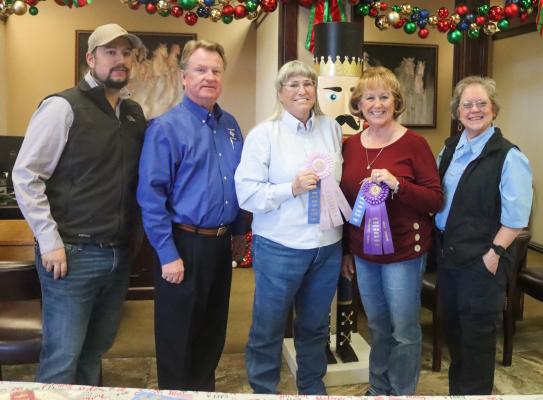 The Pecan Show Food adult grand champion was Stacy Pasqua with her first place pecan pie cheesecake. The reserve grand champion was Melissa Mills with her pecan brittle. From left are Payton Keifer, Pecos County State Bank President George Hansard, reserve grand champion Melissa Mills, grand champion Stacy Pasqua and Extension Agent Karan Heffelfinger. Photo by Shawn Yorks