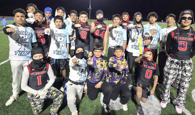 Football - Athletes from across the tournament pose together showing off their championship rings after a full weekend of flag football competition. Courtesy Photo.