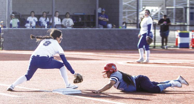 Mia Garcia (9) nearly tags out a Greenwood baserunner via a pick off attempt from catcher Yadira Hernandez. Photo by Nathan Heuer