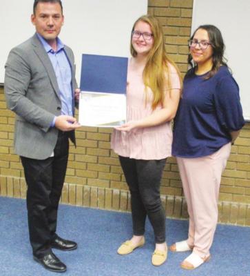 High School Student of the Month Desiree Williams with principal Roy Alvarado.