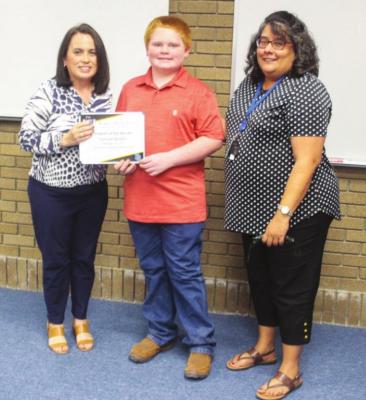 Middle School Student of the Month Samuel Sparks with principal Linda Chavez.