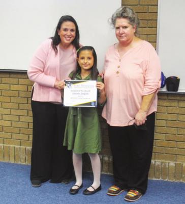 Alamo Student of the Month Debanhi Salgado with principal Sabrina Cordova.