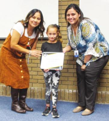 Apache Student of the Month Sophia Sevillano with principal Karina Pacheco.