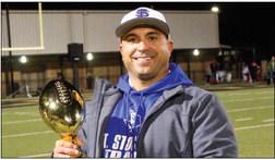 In his first year at the helm of the Panthers football program, Fort Stockton native Jeremy Hickman added a bidistrict title to his head coaching resume and led the Panthers to their second 10-win season in school history. Hickman is pictured with the 4A-2 bi-district championship trophy following Friday’s game against the Rangers. Photo by Nathan Heuer
