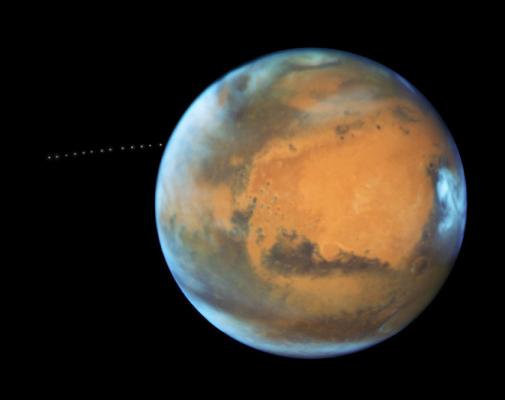 Mars and its orbiting moon Phobos as seen by the Hubble Telescope, which documented the moon’s orbit with time-lapse photography. Photo courtesy of NASA