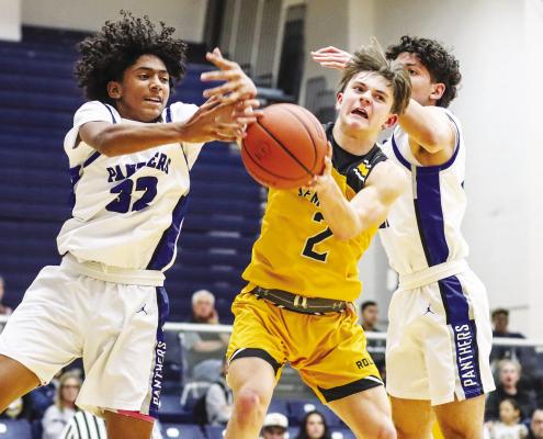 Evan Cordero (32) fights for a rebound last Friday in the Fort Stockton varsity game against Seminole. Photos by Shawn Yorks