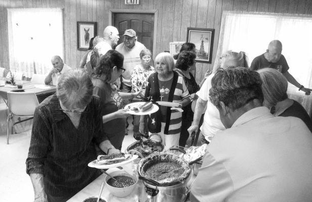A room full of members line up for a buffet meal at the Senior Center for their recent luncheon. Photo courtesy of the Pecos County Senior Citizens Center.