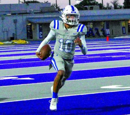 Marco Garcia carries the ball Friday in Pecos. Courtesy photo by Collette Barragan