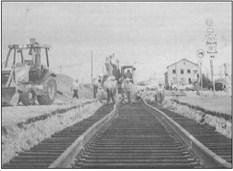 September 2016: FIXING IT UP – Crews make repairs to the railroad crossing at Main and Dickinson in 2016.
